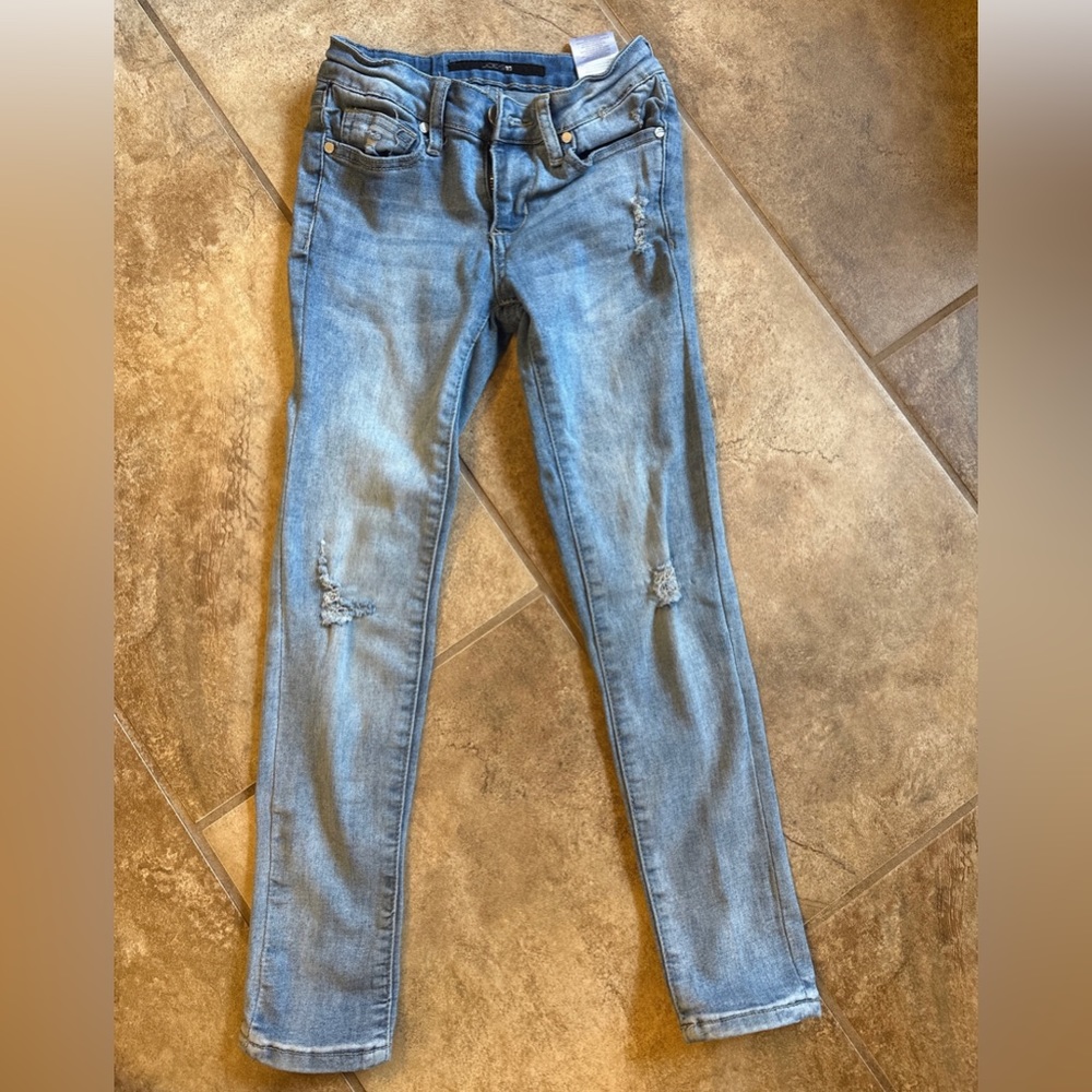 Joe’s girls jeans. All holes original to jeans. Only worn a handful of times.